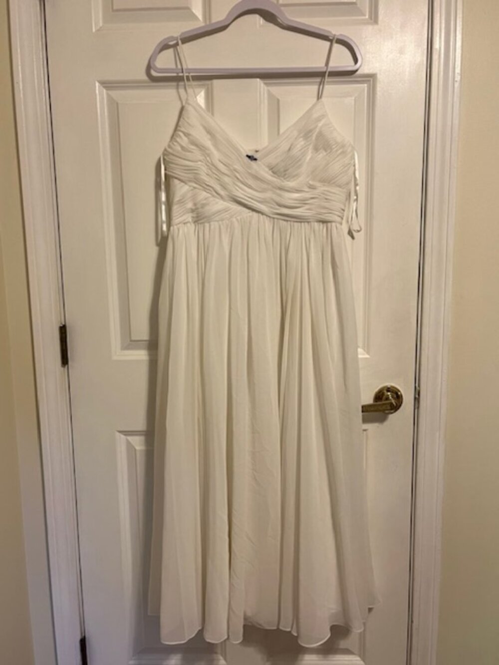 White fancy dress, with surplice bodice, full skirt.